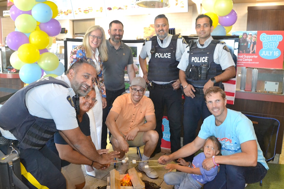 Police officers alongside federal and municipal politicians took part in Tim Hortons Camp Day campaign on July 16, 2025. 