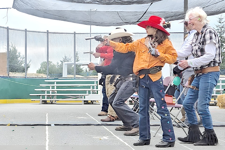 Gabriella Antao, 10, from Surrey, wearing a red cowboy hat, won the Annie Oakley division at the Thunderbird Fast Draw Club's  World Blank Fast Draw Championships at this year's Aldergrove Fair.
