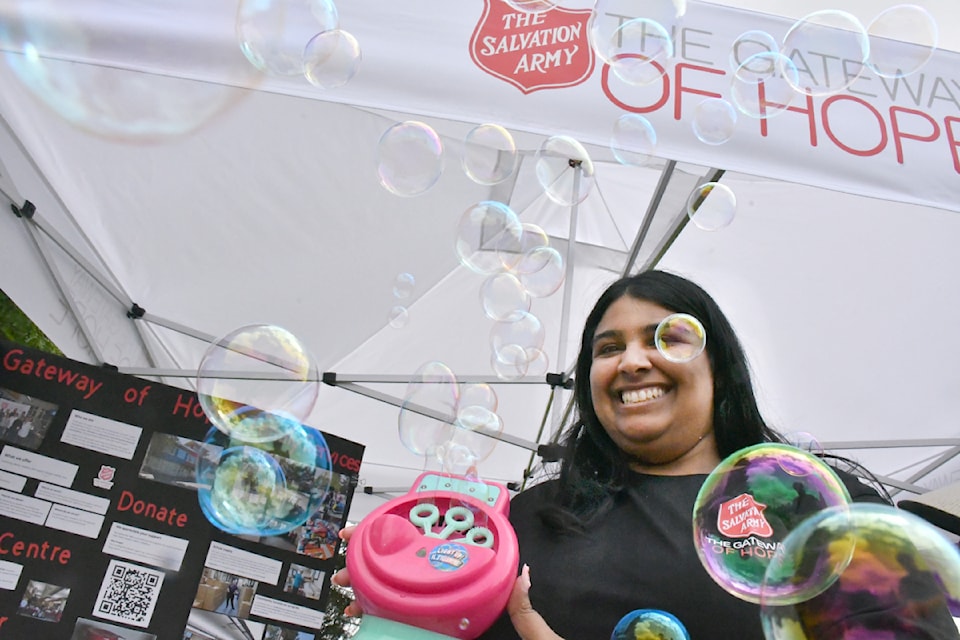 Jasmine Sidhu is the Gateway of Hope fundraising coordinator and operated a bubble making maching at  Community Day on June 14, 2025. The bubbles wafted around Douglas Park. 