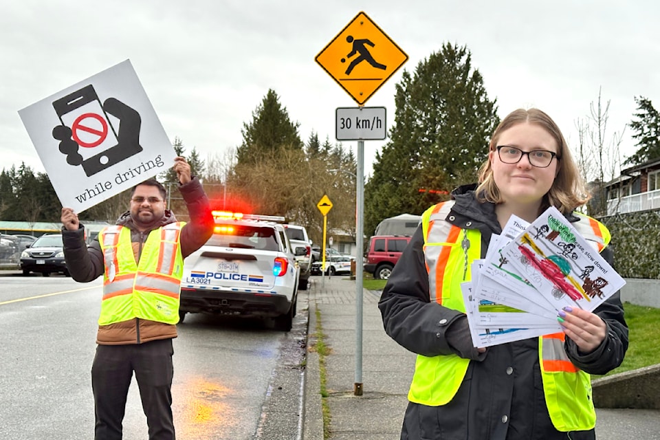Mohammed Burhanudeen and Jayde Marno, both RCMP volunteers, were at Blacklock Fine Arts Elementary on Wednesday, March 12, 2025, to help spread a safety message. 