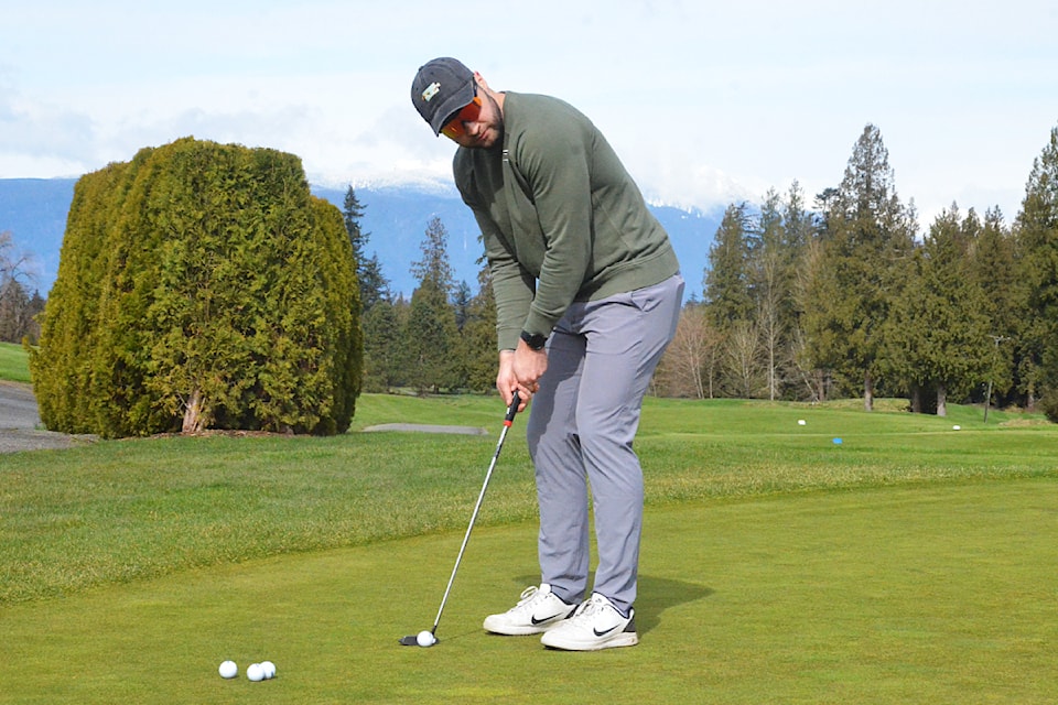 Austin Buss practiced putting at Redwoods Golf Course.
