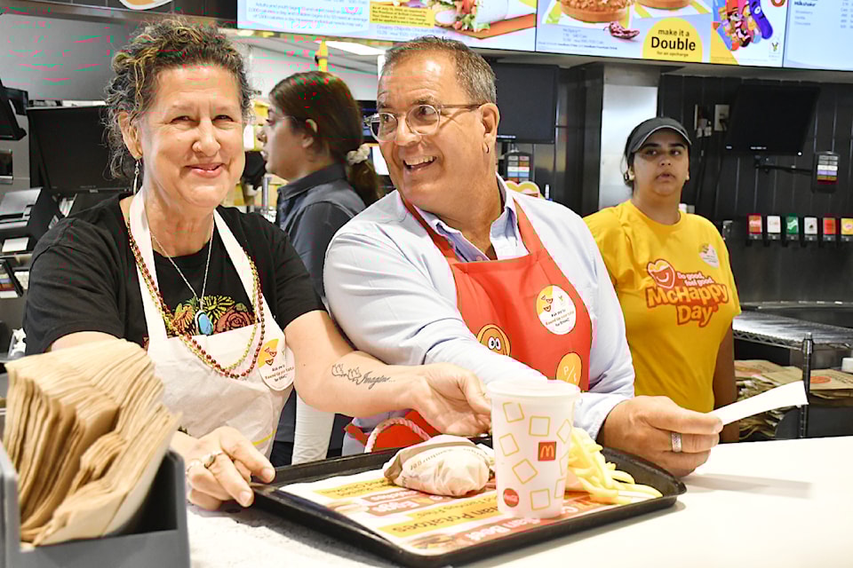 91ԭ City Councillors Rosemary Wallace and Leith White served up food for McHappy Day.