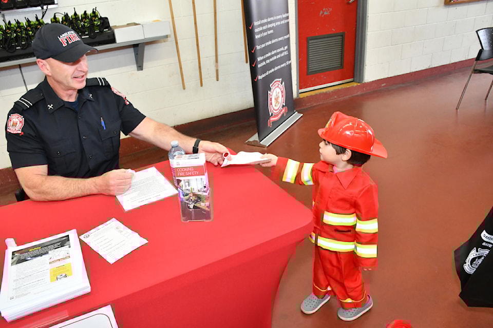 People at the Langley City Fire Rescue open house on May 8, 2025, went from display to display learning about topics such as kitchen fire safety and smoke detectors to extinguishers and emergency preparedness. 