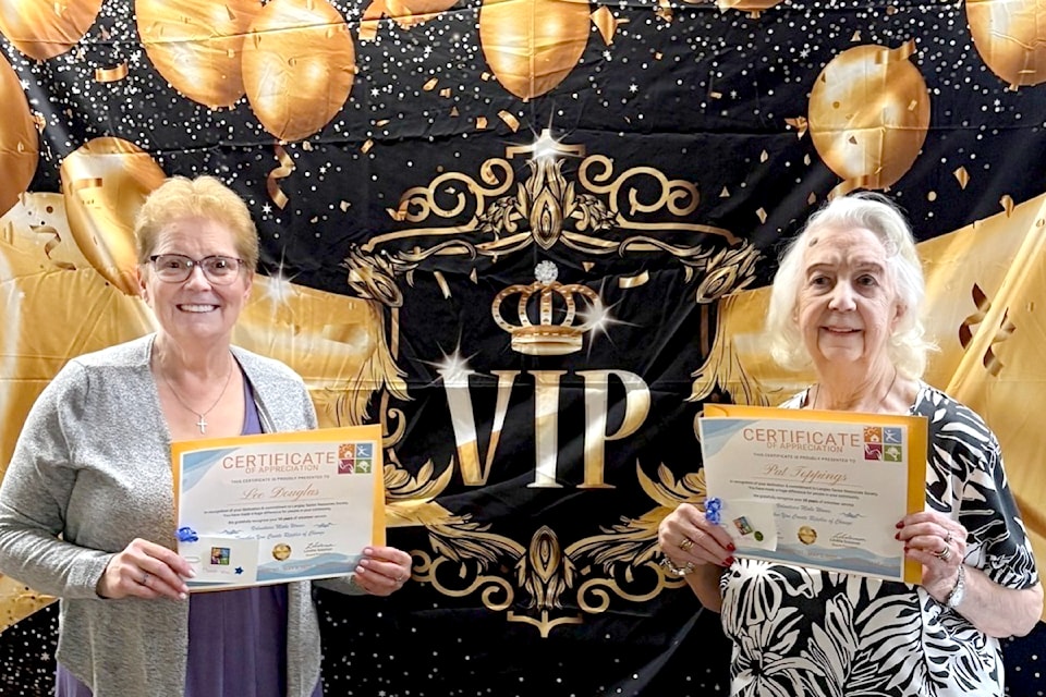 Lee Douglas and Pat Tippings were longtime volunteers who were honoured at the May 1 celebration. 
