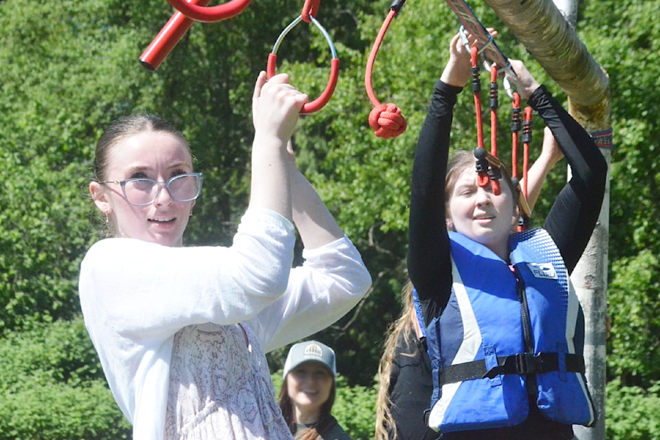 Julia and Lyla Greengrass crossed an obstacle during the Tuff Wally obstacle course at Walnut Grove Secondary on May 28.