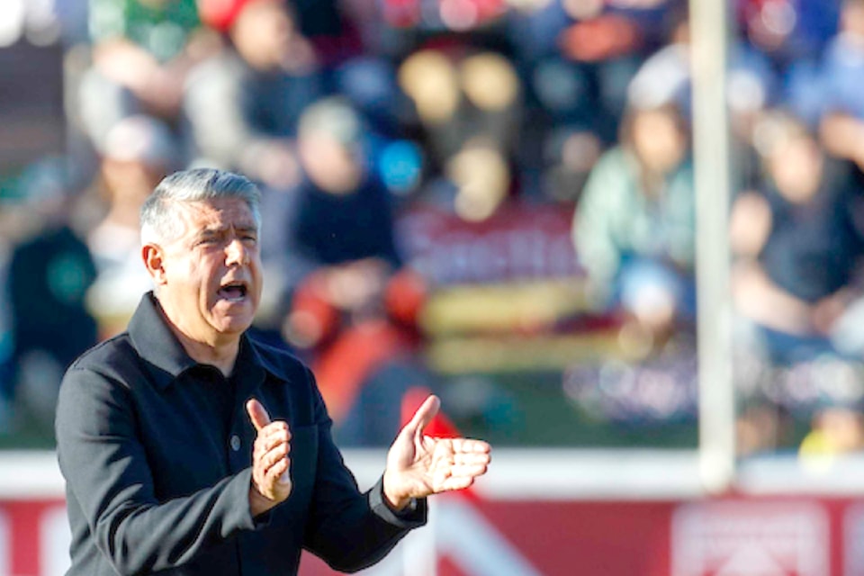 Vancouver FC's Eagles coach Afshin Ghotbi directing players during a recent game in Calgary.