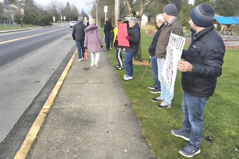 Protesters alleging racist harassment against students gathered near Dorothy Peacock School in Langley on Monday, Jan. 13.