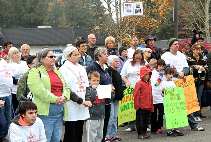 Listening to a speaker at the Rally