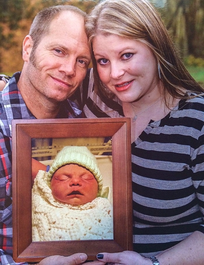 submitted photo Lora and Sean Boshoff hold a photo of their baby, Mia.