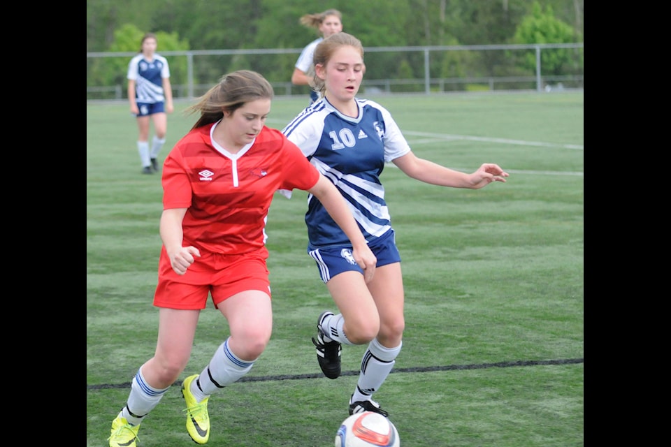 DW Poppy Redhawks’ Kelsea Stewart (left) and 91ԭ Fundamental Titans’ Halle Owen battle for the ball during the Fraser Valley senior girls AA soccer championship final at Willoughby Community Park on May 17. The Redhawks won 2-0. Gary Ahuja 91ԭ Times
