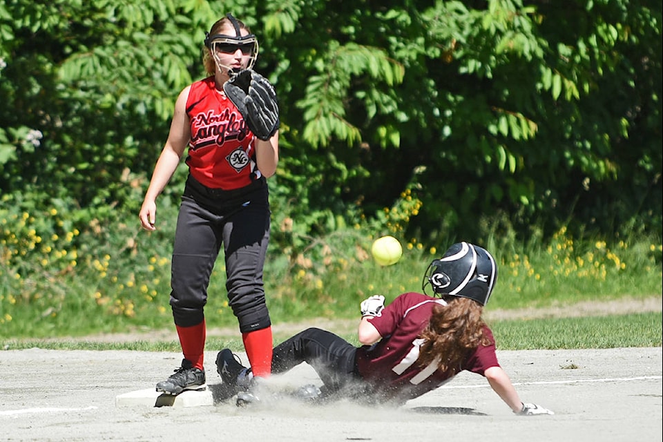 91ԭ Knights’ Samantha Jones slides into third base during her team’s game against the North 91ԭ Knights on Saturday at Noel Booth Park. The U14 game was part of the 2017 91ԭ fastpitch championships co-hosted by 91ԭ Fastball Association and North 91ԭ Softball at ball fields throughout 91ԭ. Miranda Gathercole 91ԭ Times