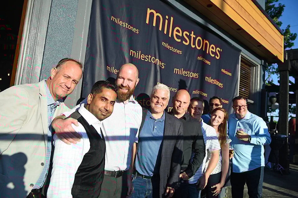 Milestones managers pose for a photo at the grand reopening on July 27. Miranda Gathercole 91ԭ Times