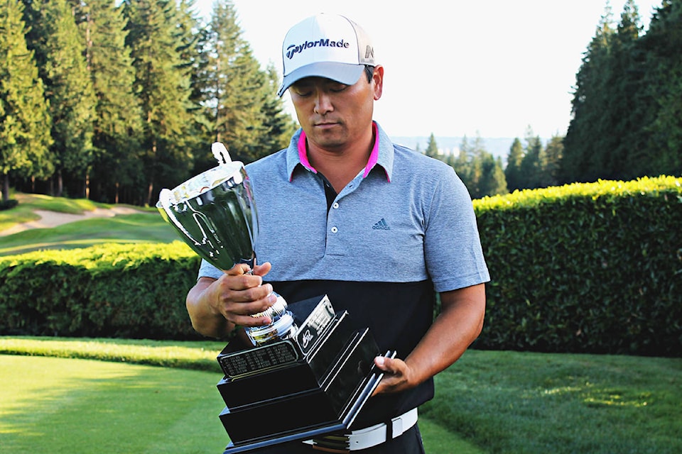 8273180_web1_John-Shin-checks-out-trophy