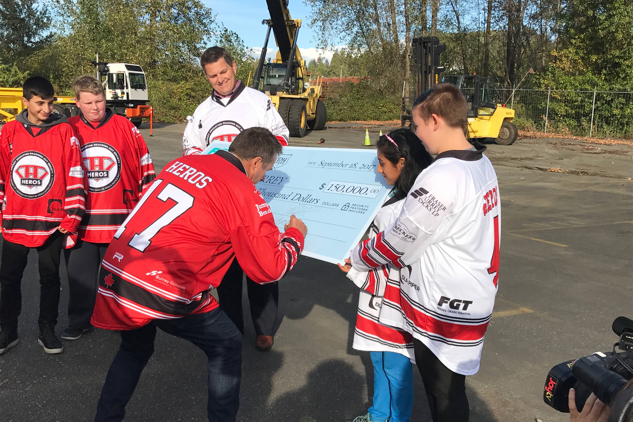8611691_web1_Casey-McCawley-FGT_signs-150K-donation-cheque