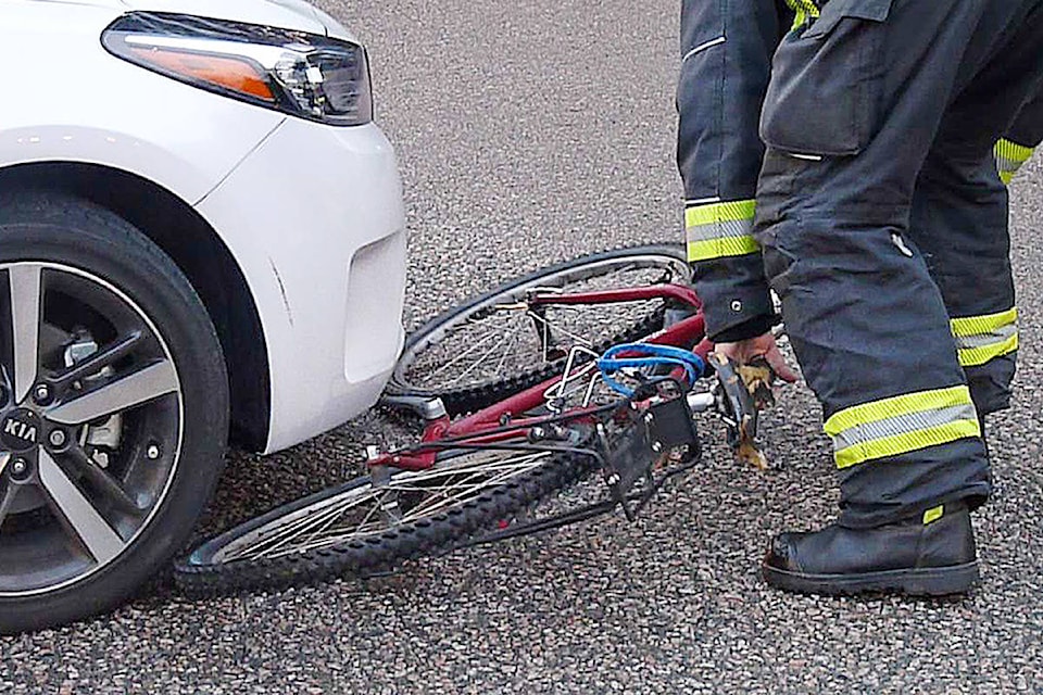 10128917_web1_180110-LAT-bike-and-car-collide