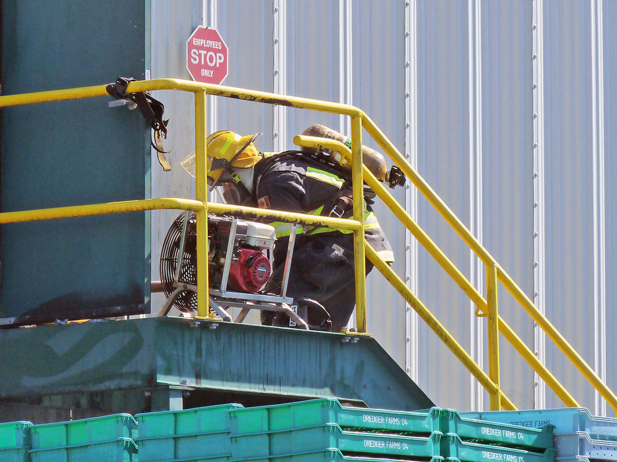12452433_web1_180624-LAT-firefighters-at-farm-1