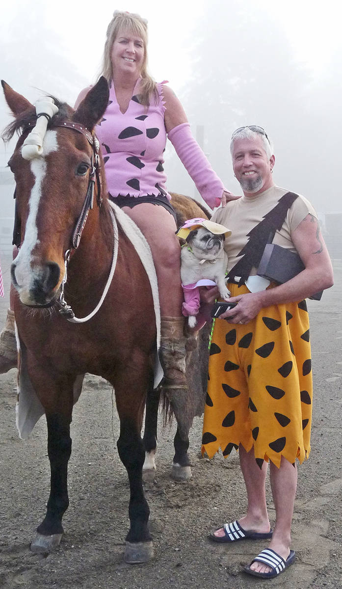 14062402_web1_181020-LAT-Halloween-on-horseback-flintstones