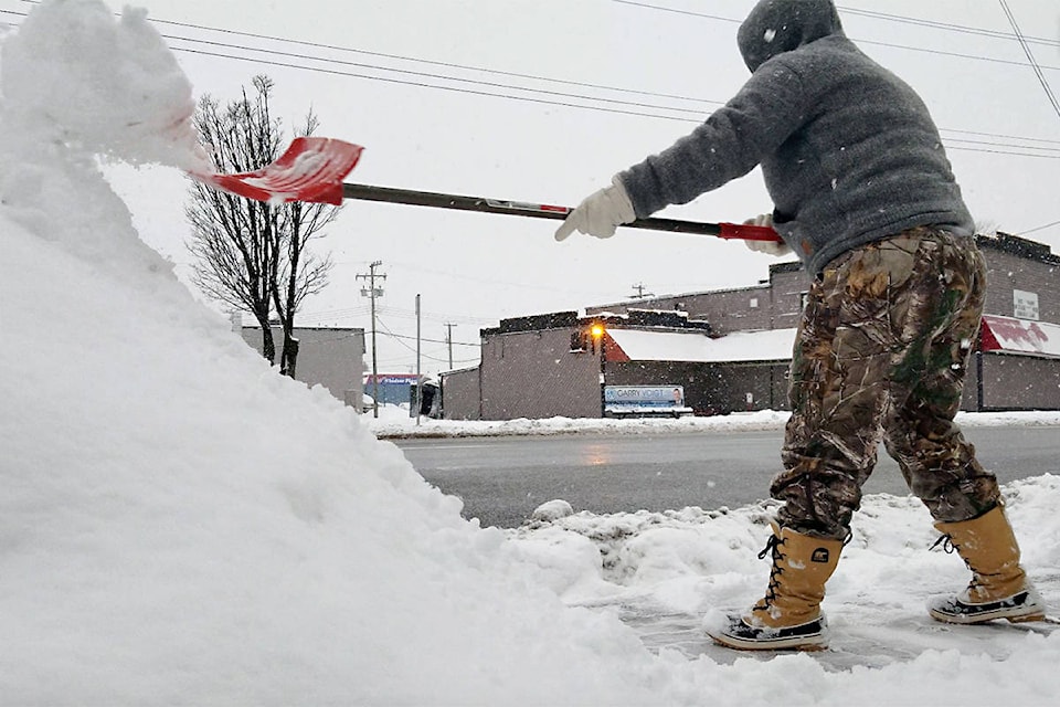 15516561_web1_190212-LAD-shoveling-snow