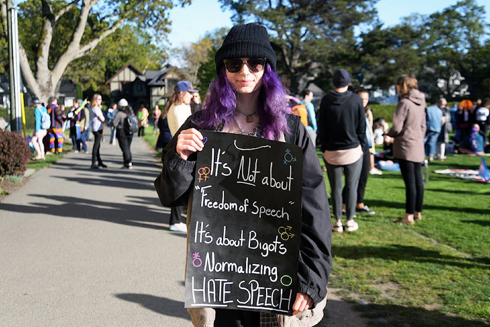 A protestor holds a sign outside the Windsor Pavilion Thursday night. More than 200 showed up to counter the evening’s anti-SOGI program, the Erosion of Freedom. (Nina Grossman/News Staff)