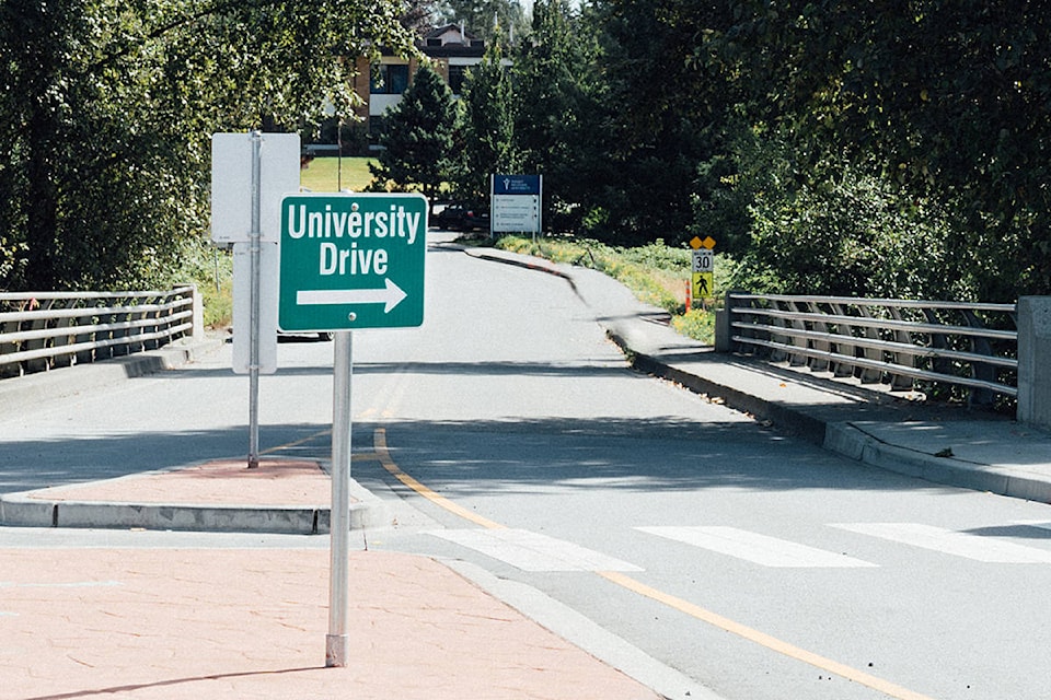 22686170_web1_copy_200912-LAT-Road-renamed-for-university-sign_1