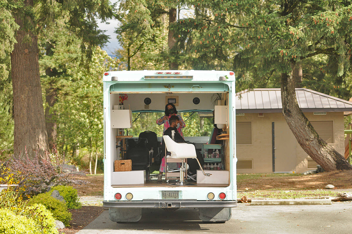 Jenny Squires cuts her husband Chris Squires鈥 hair on Sept. 25, 2020 in her mobile hair studio called Prime Real Estate Salon. (Jenna Hauck/ Chilliwack Progress)