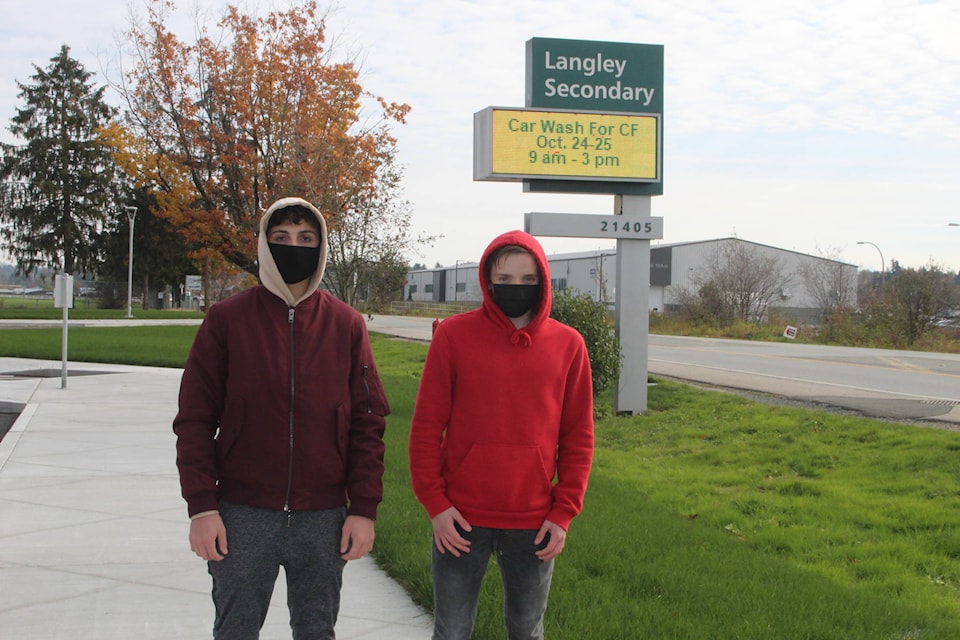 Jacob Evans and Ethan Tivy, along with other classmates at Langley Secondary School, held a car wash fundraiser on the weekend of Oct. 24 and 25 to raise money for Cystic Fibrosis Canada. (Erin Florko/Special to Langley Advance Times)