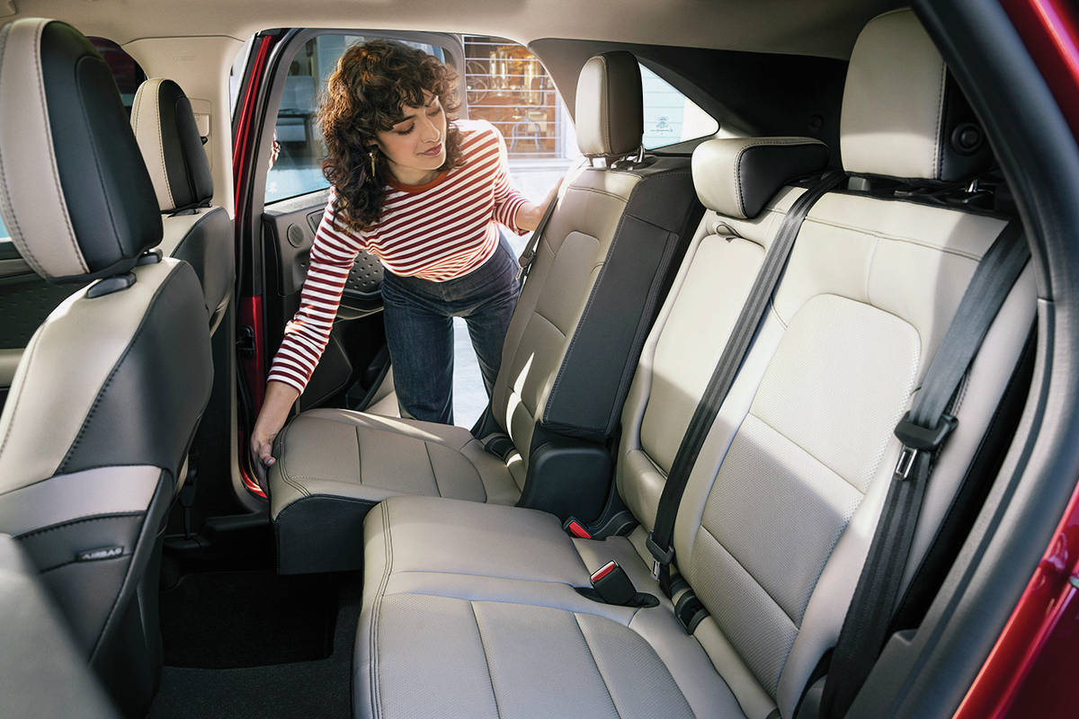 The only reason to move the rear seat forward — to give up leg room — is to make some extra space for cargo. This feature is not available with the hybrid models. PHOTO: FORD