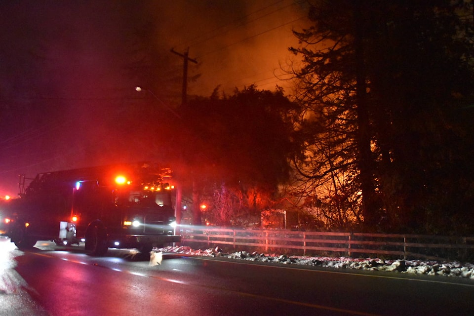 Township of Langley firefighters were called to a house fire on Dec. 26, 2020 in the 2000-block of 200th St. around 12:30 p.m. Three occupants were able to escape, but two dogs and a pet bird remain unaccounted for. (Curtis Kreklau/Special to Langley Advance Times)