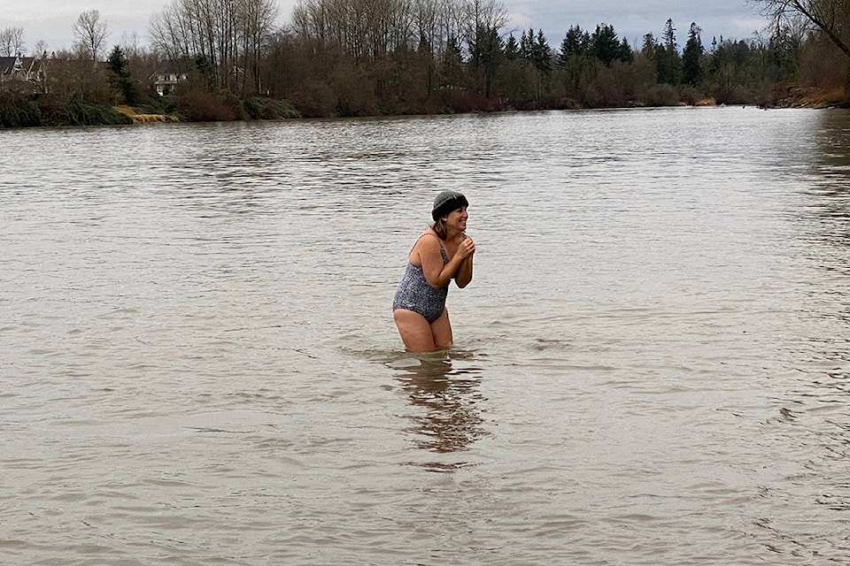 About 30 people braved the chilly water on New Year’s Day 2020 in Fort Langley for the annual unofficial polar bear plunge. (Joti Grewal/Langley Advance Times)