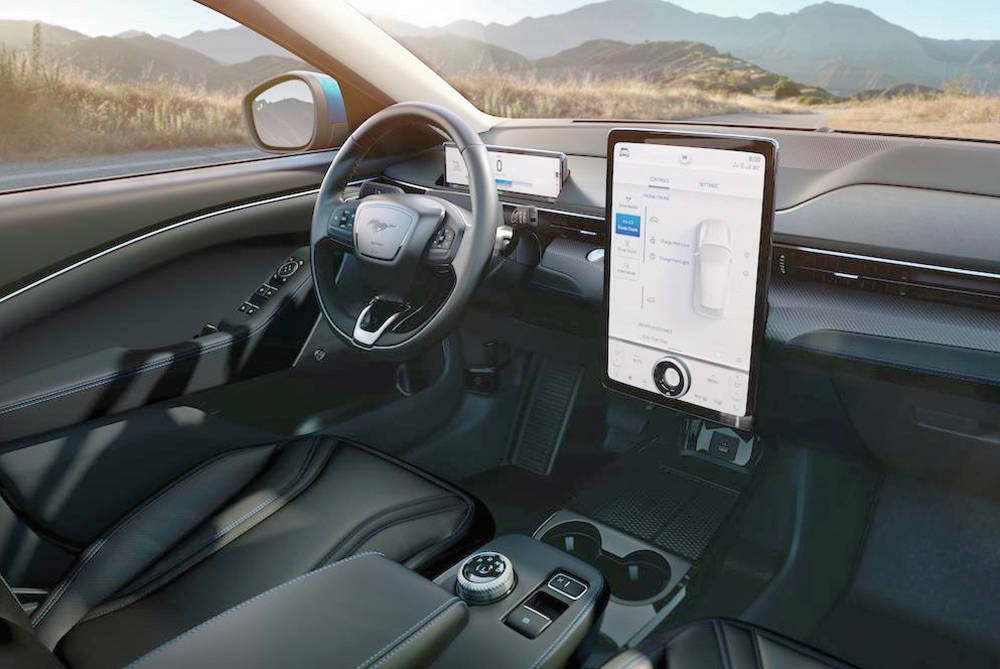 In the interior, a floating, flip-up armrest doubles as a place to store purses or bags. PHOTO: FORD