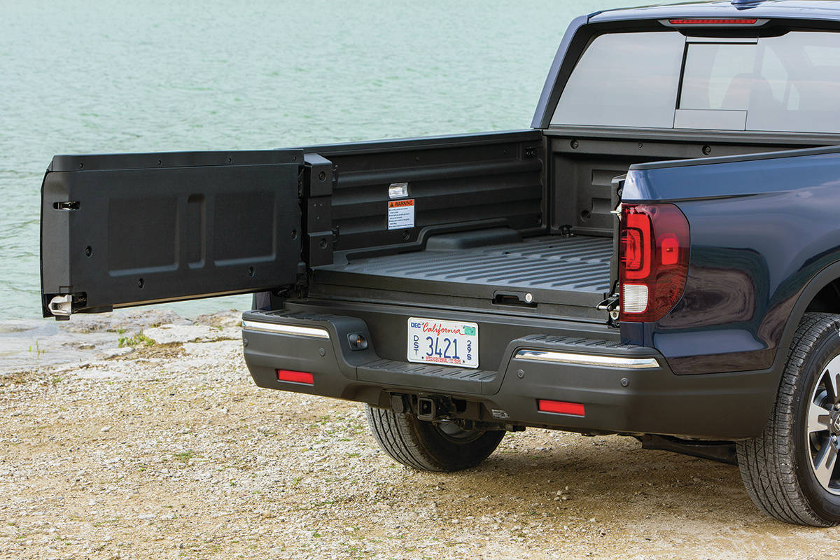 The Ridgeline聮s tailgate swings out from the right, or it can be dropped down (it can hold 135 kilograms). PHOTO: HONDA
