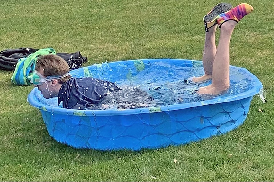 Christian Burton is not a cold-weather kind of athlete, but he took the plunge anyway, getting dunked to help raise funds for Special Olympics. (Special to Langley Advance Times)