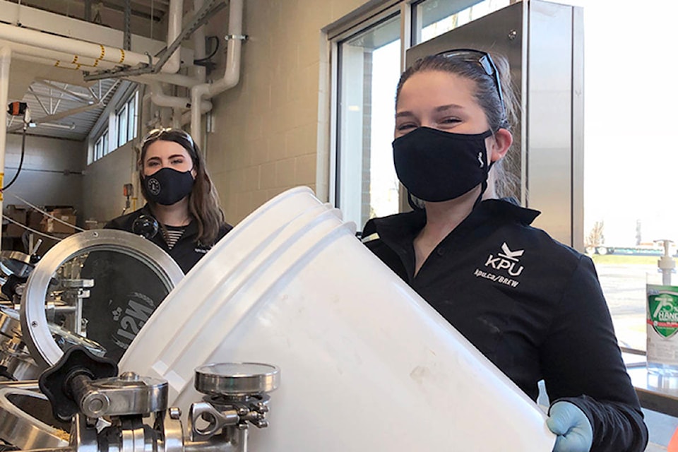 Rebecca Deil (left) and Emily Comeau making the Pink Boots beer. (KPU/Special to the Langley Advance Times)