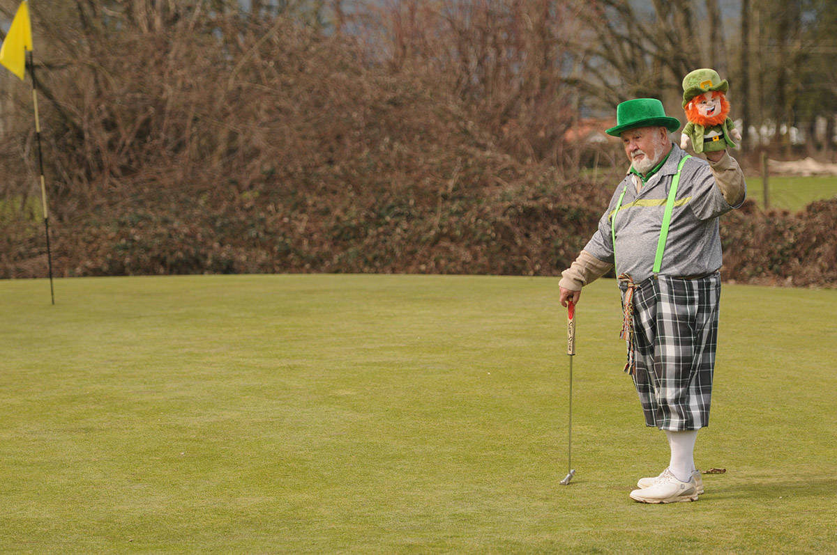 Patrick O聮Shea holds up his leprechaun golf head cover during a round of golf at Meadowlands Golf and Country Club on St. Patrick聮s Day on March 17, 2021. (Jenna Hauck/ Chilliwack Progress)