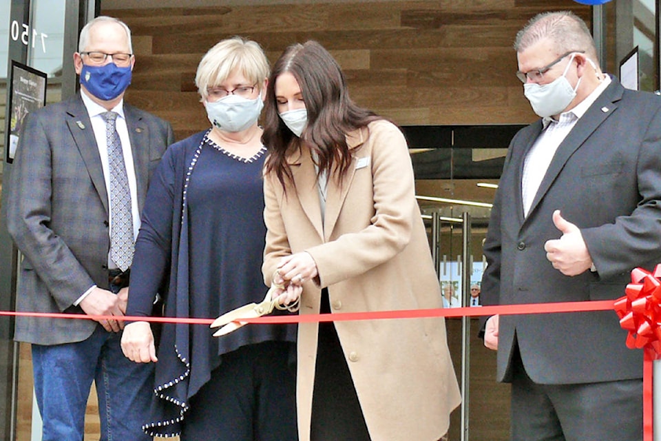 24663033_web1_210327-LAT-ACC-opens-Willoughby-branch-ribbon_1