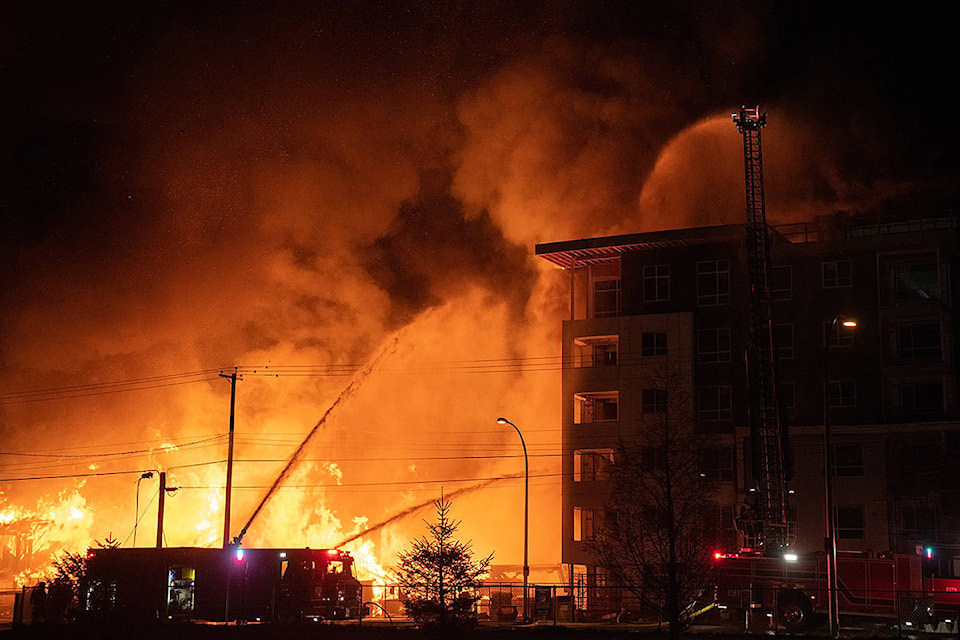 Fire consumed a condo development project under construction at 208th Street and 80th Avenue Monday night. Many spectators shared their images. (Daniel Gerstner/Instagram: @gerstner/Special to Langley Advance Times)
