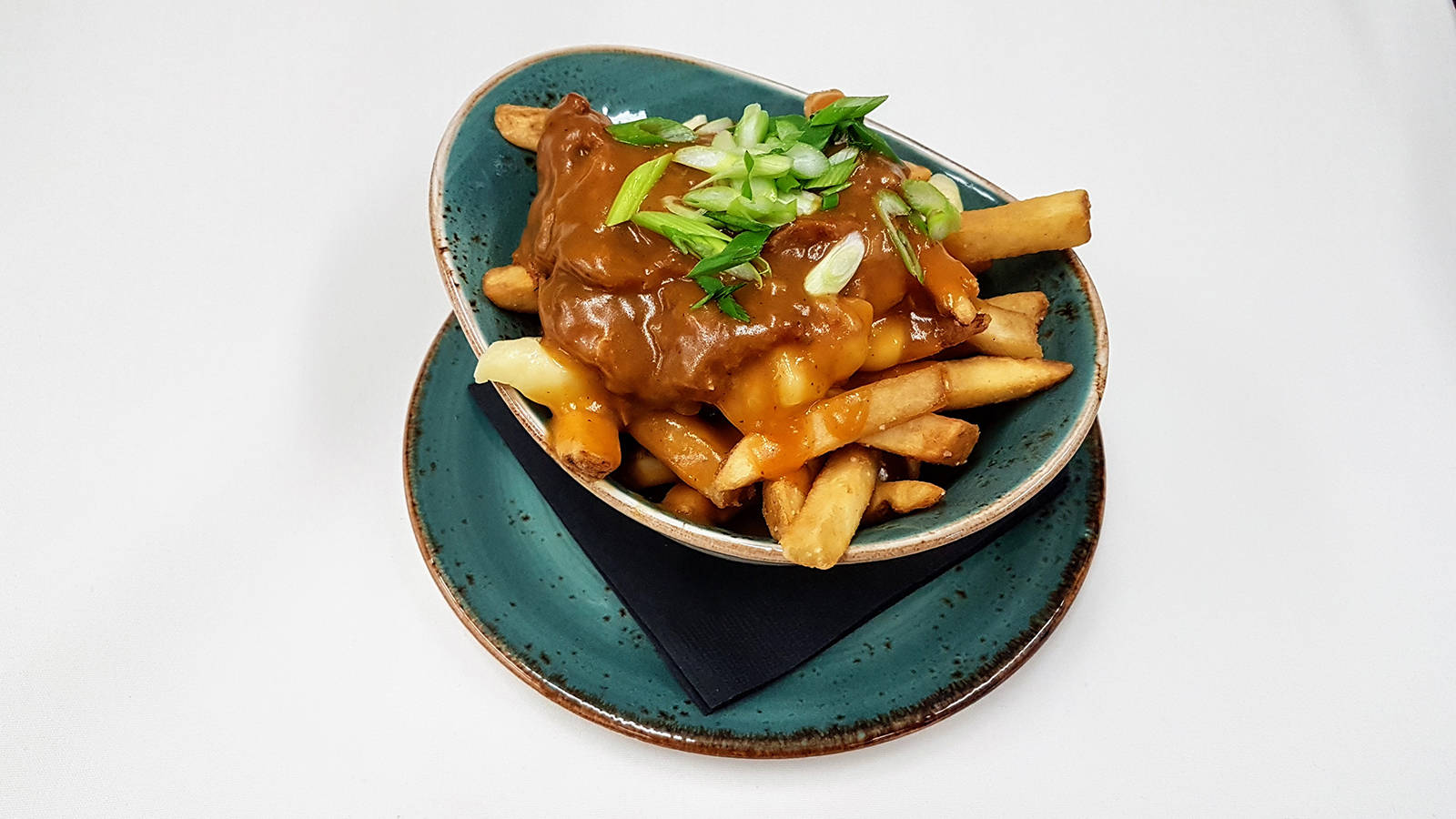 For Mealshares annual Poutine with Purpose event, LURE Restaurant and Bar presents its Pulled Pork Poutine – house-smoked pulled pork, Kennebec fries tossed with fresh Armstrong, B.C. cheese curds, finished with Lures chicken-duck gravy.