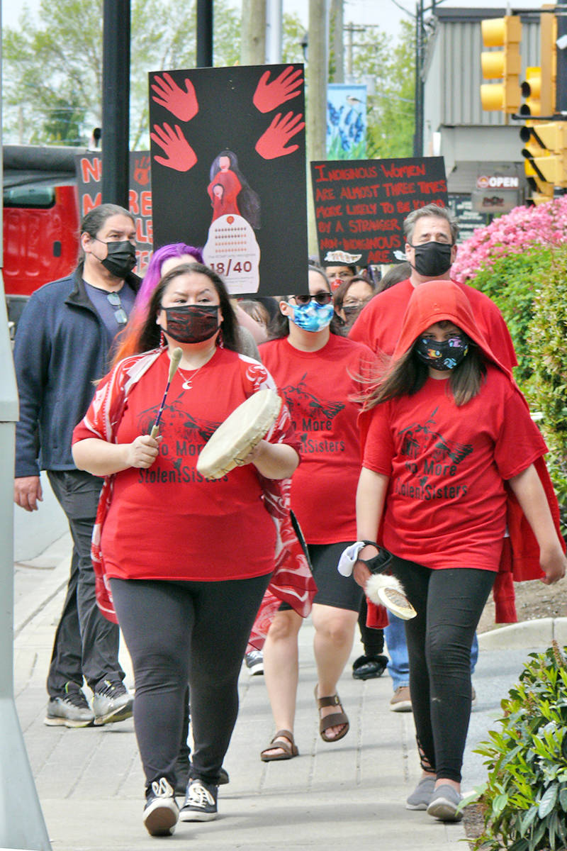 25079649_web1_210505-LAT-DF-Red-Skirt-Day-marchers_1