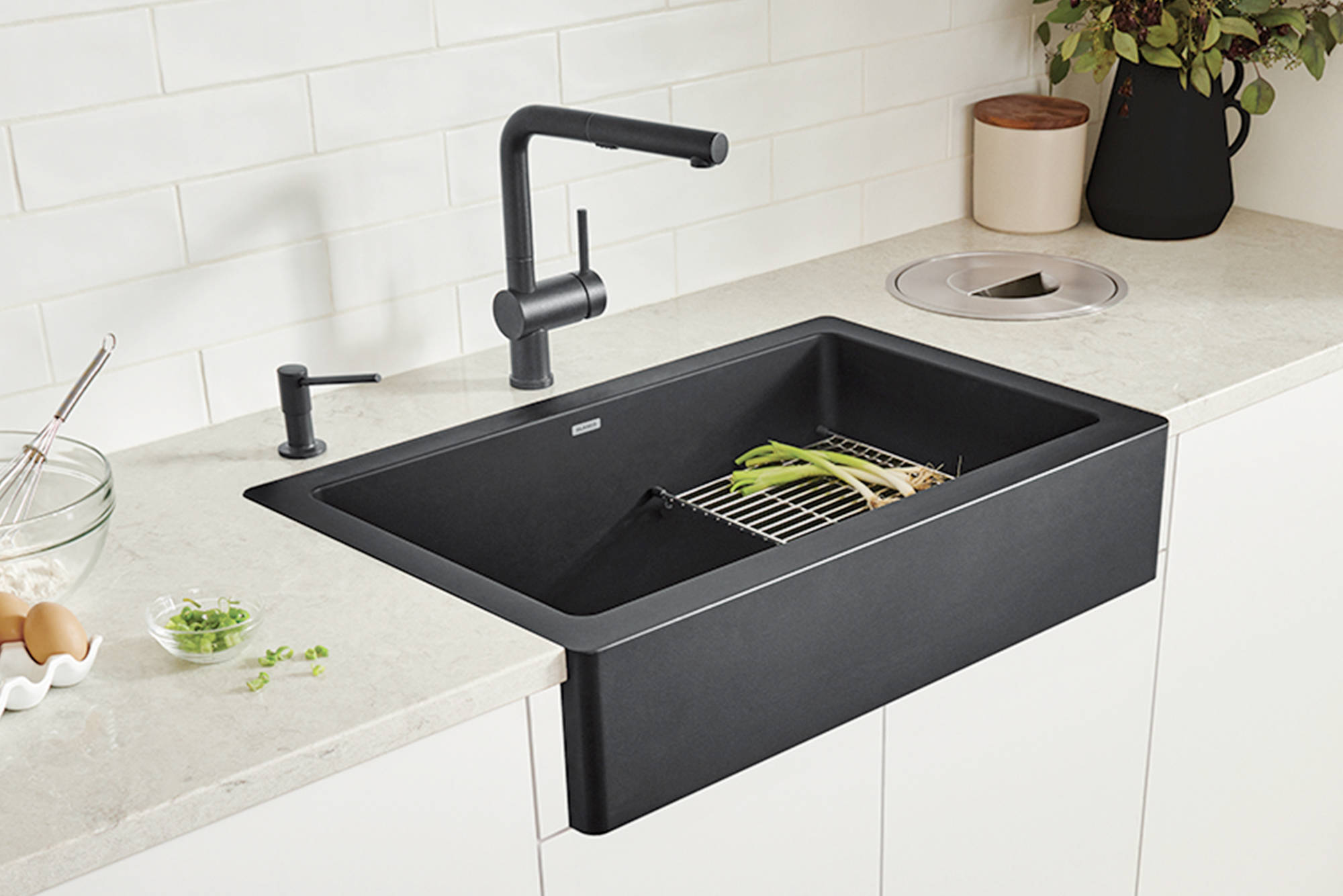 The VINTERA farmhouse kitchen sink collection is available in an array of colours, including concrete grey, truffle and coal black.