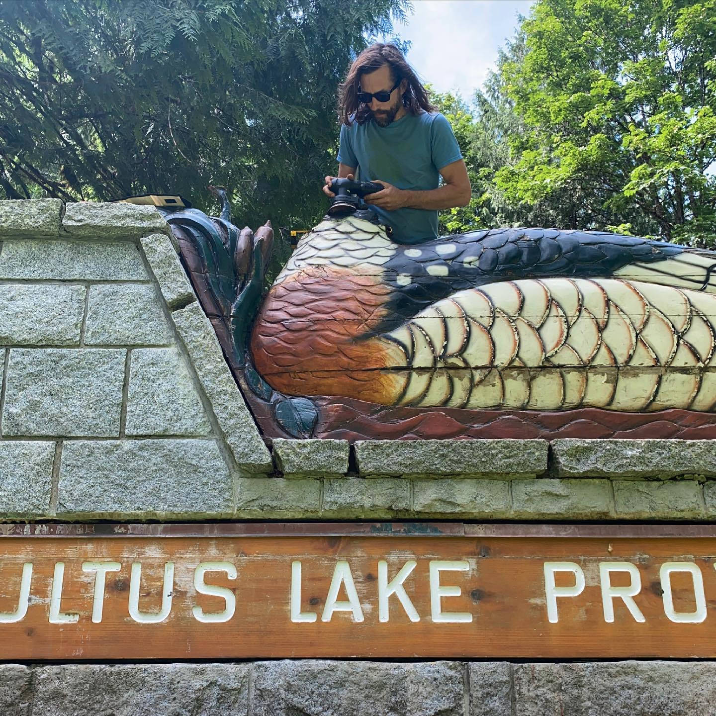 Chilliwack woodworker Jeremy Sibley at the merganser statue at the entrance of Cultus Lake Provincial Park (Jeremy Sibley)