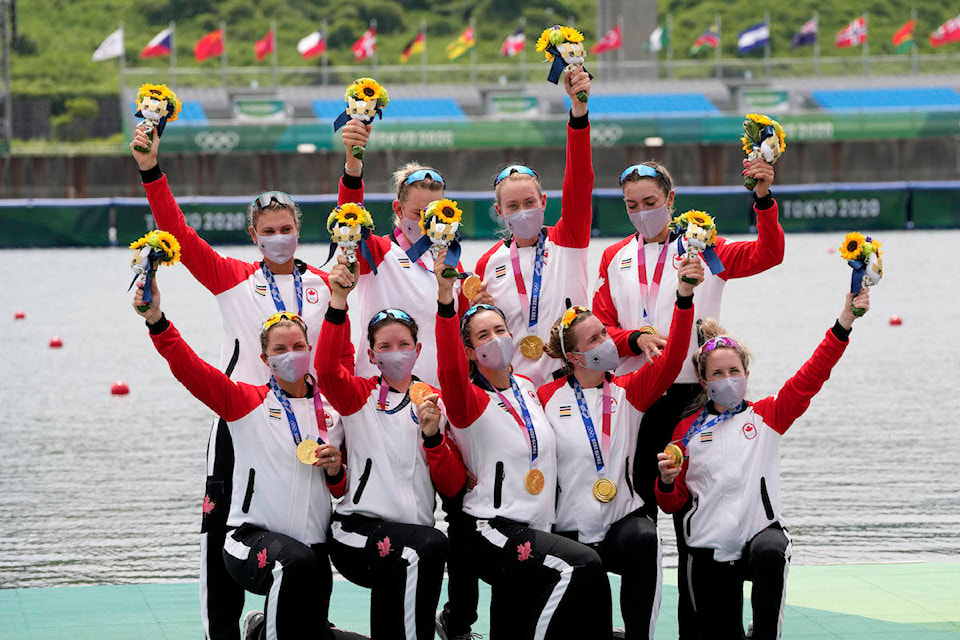 Gold medalists Lisa Roman, Kasia Gruchalla-Wesierski, Christine Roper, Andrea Proske, Susanne Grainger, Madison Mailey, Sydney Payne, Avalon Wasteneys and Kristen Kit of Canada pose during the medal ceremony for the women’s rowing eight final lat the 2020 Summer Olympics, Friday, July 30, 2021, in Tokyo, Japan. (AP Photo/Lee Jin-man)