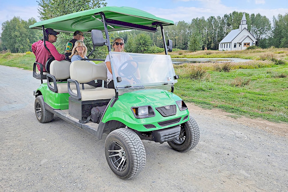 Melanie MacInnes provided a preview on Sunday, Aug 22, 2021 of the drive-through version of the Aldergrove Fair that will route through her farm, including the standing set of the Hallmark Channel show “When Calls the Heart”, visible behind them. (Dan Ferguson/Langley Advance Times)