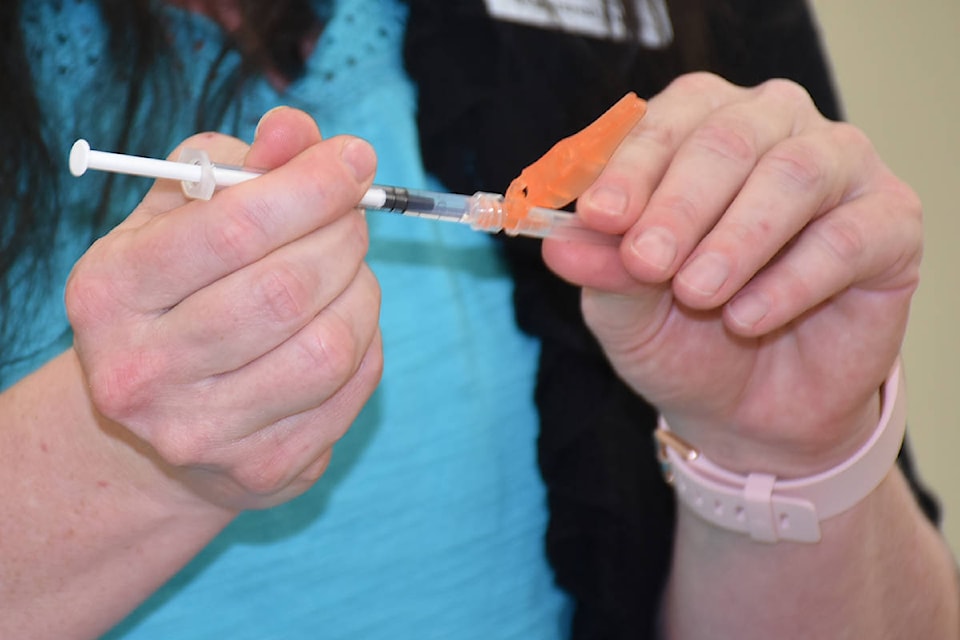 26327350_web1_COVIDvaccinationMarch26.2021_8