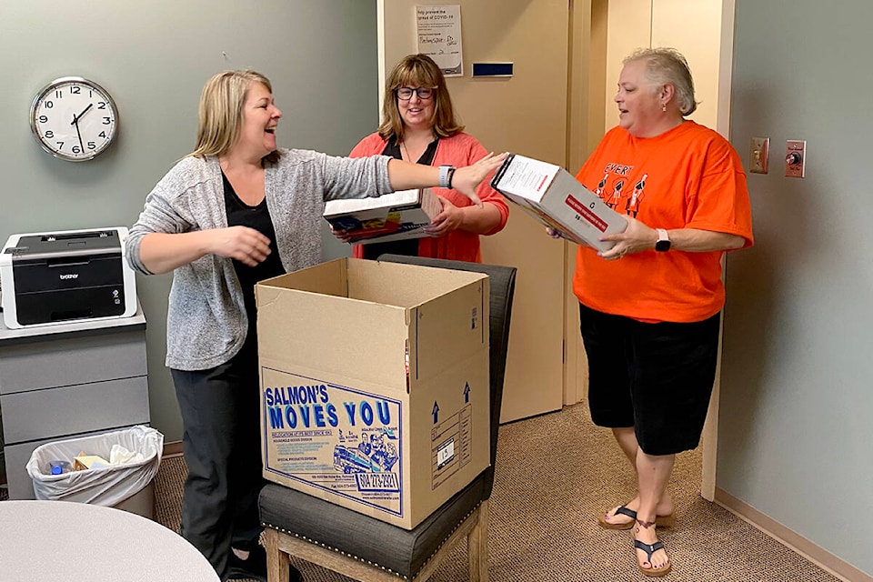 Collette Bohach, Mardel Donnelly and Rena Andronek help pack up the offices at Ishtar Women’s Resource Society as staff moved to a new space at 223-20316 56 Ave. (Joti Grewal/Langley Advance Times)