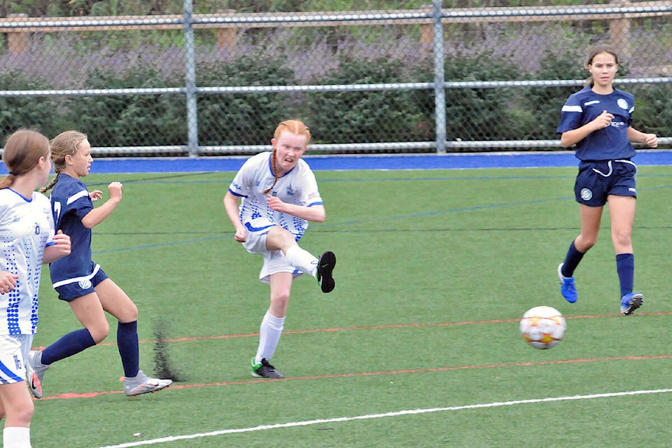 Langley United’s Leah Waddell took a shot during a game against Vancouver Island Wave on Sunday, Sept. 19 in the first BC Soccer Premier League games since the return to play was shut down due to Covid 19. Both teams played to a draw. (Dan Ferguson/Langley Advance Times)