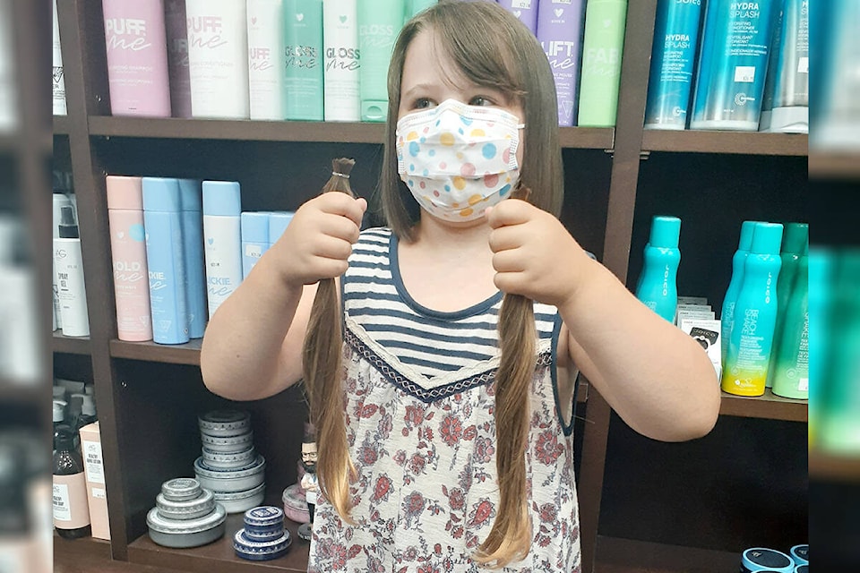 Seven-year-old Averie Janzen donated 12 inches of her hair to make wigs for cancer patients. It took the 91ԭ girl a year and a half to grow it out. (Linda Colpitts/Special to 91ԭ Advance Times)