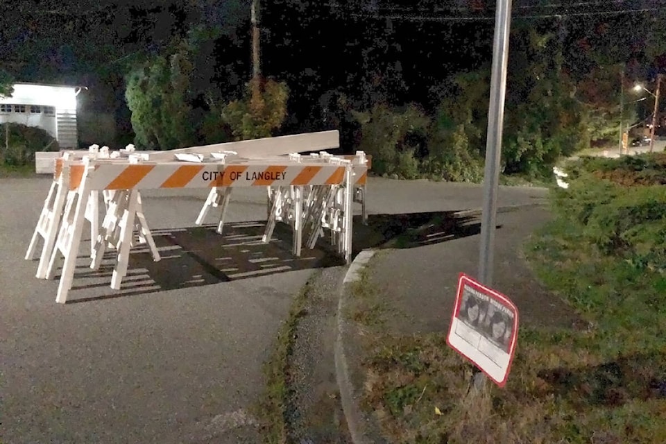 Police removed barricades on Friday, Sept. 24, from the street running past the home of missing Langley City woman Naomi Onotera. (Heather Colpitts/Langley Advance Times)