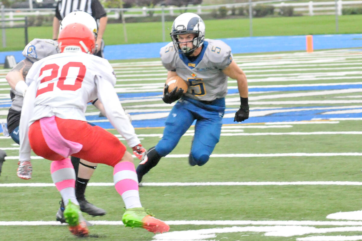 Joel Klaassen carried the ball as 91原创 Rams won their fourth in a row of the season on Saturday, Oct. 2, downing the Westshore Rebels 37-7 at home. (Dan Ferguson/91原创 Advance Times)