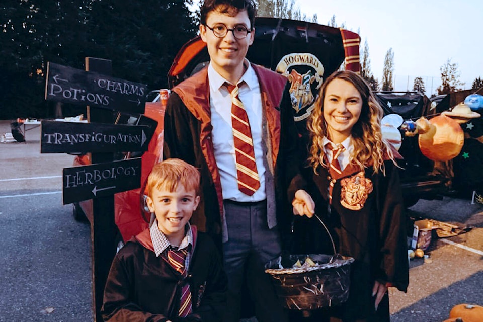 Town+Field Church is hosting Trunk or Treat at the church parking lot, where kids can fill their bags with Halloween treats in a safe, outdoor environment. This photo shows a family enjoying as past event. The community event has been held for at least 10 years. (Sara Hawthorne/Special to )