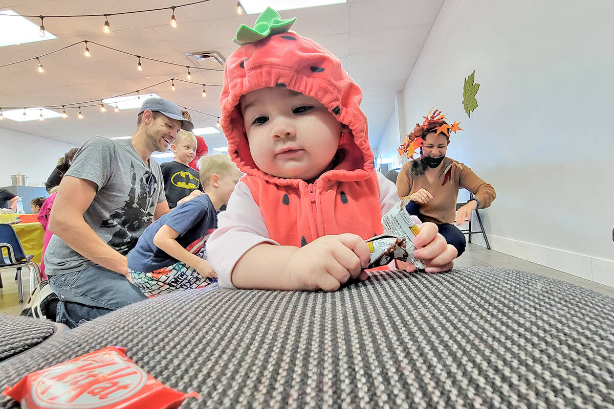 Emily Hope, 10 months, eyed a treat at the Aldergrove Vineyard church fall festival open house on Sunday, Oct. 31. (Dan Ferguson/91原创 Advance Times)